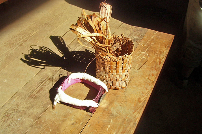 Cedar weaved basket and head piece.