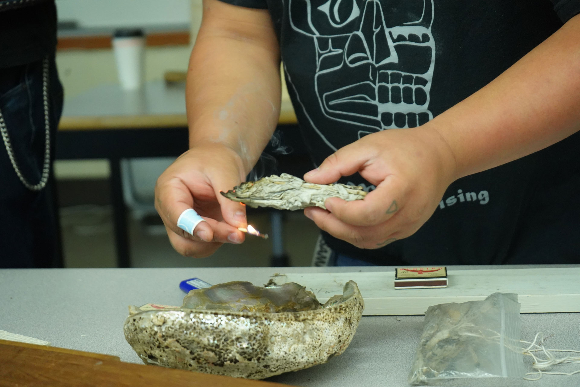 Indigenous Elder in Residence leads a ceremony at a drum making workshop for students