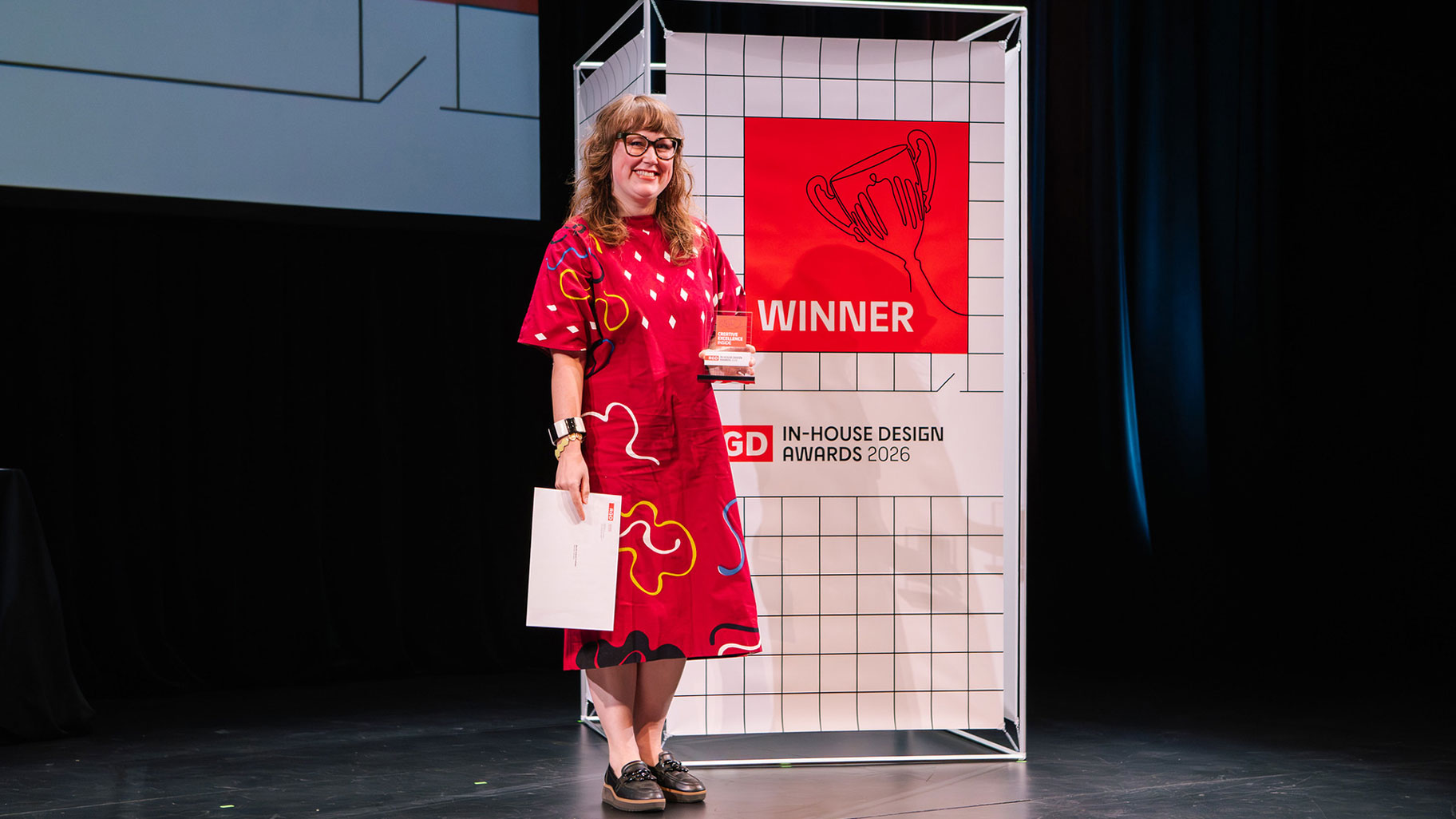 A designer accepts a branding award