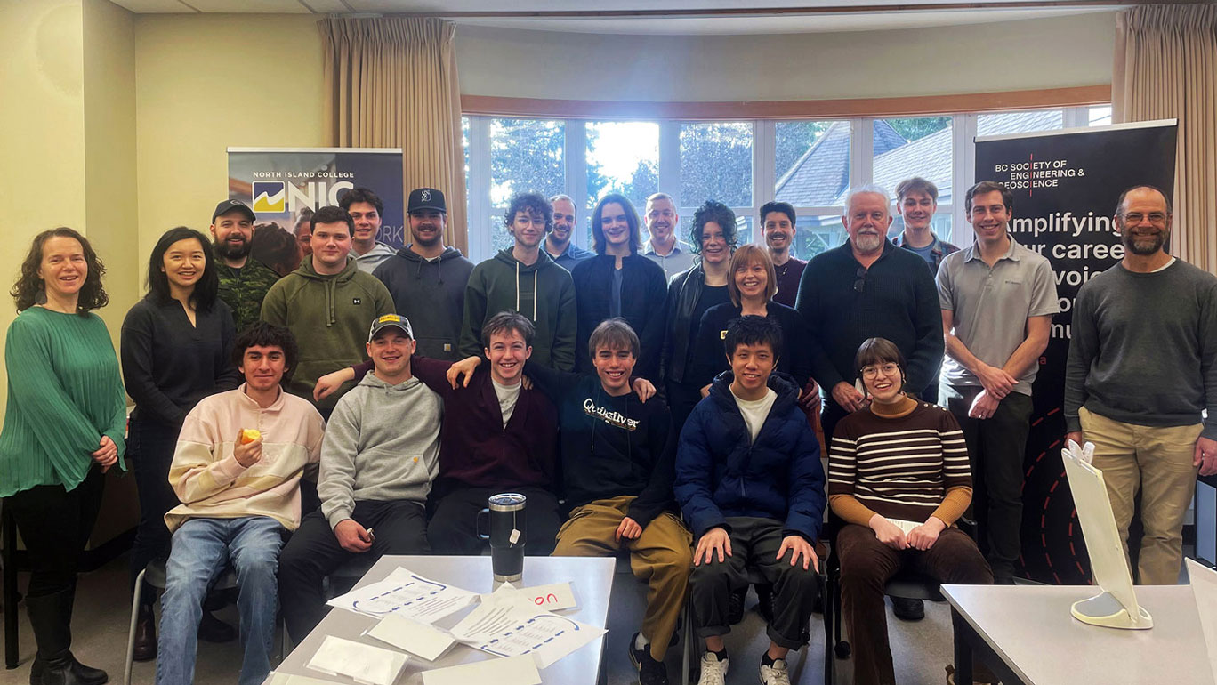 College students and professional engineers gather for a group photo