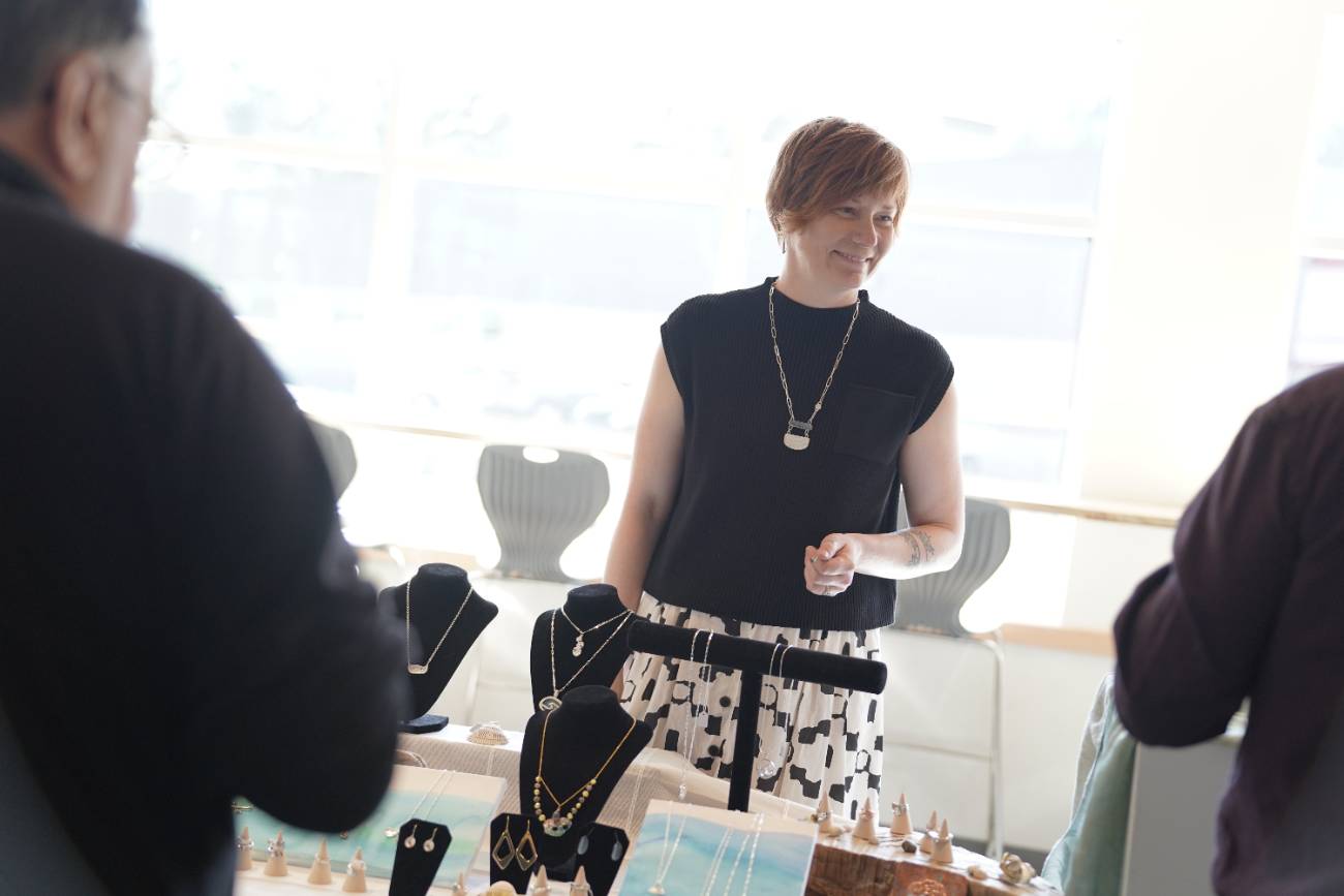 Person at jewellery exhibit